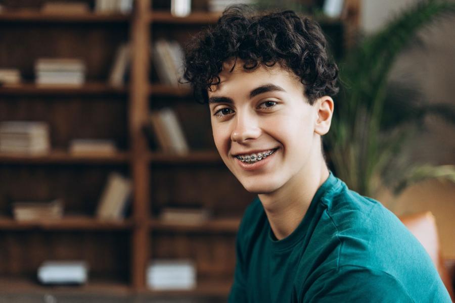 A teenage boy smiling with braces
